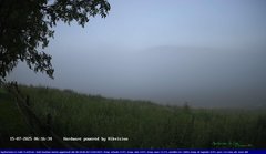 view from Webcam Cansiglio - verso la piana dei "Bech" on 2025-07-15