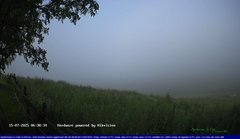 view from Webcam Cansiglio - verso la piana dei "Bech" on 2025-07-15