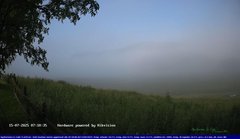 view from Webcam Cansiglio - verso la piana dei "Bech" on 2025-07-15