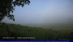 view from Webcam Cansiglio - verso la piana dei "Bech" on 2025-07-15
