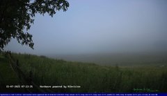 view from Webcam Cansiglio - verso la piana dei "Bech" on 2025-07-15