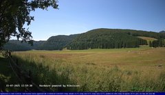 view from Webcam Cansiglio - verso la piana dei "Bech" on 2025-07-15